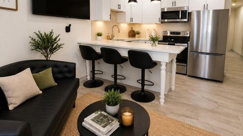 Kitchen island and living room in one of our 2-bedroom apartments, Hyde Park, Boston